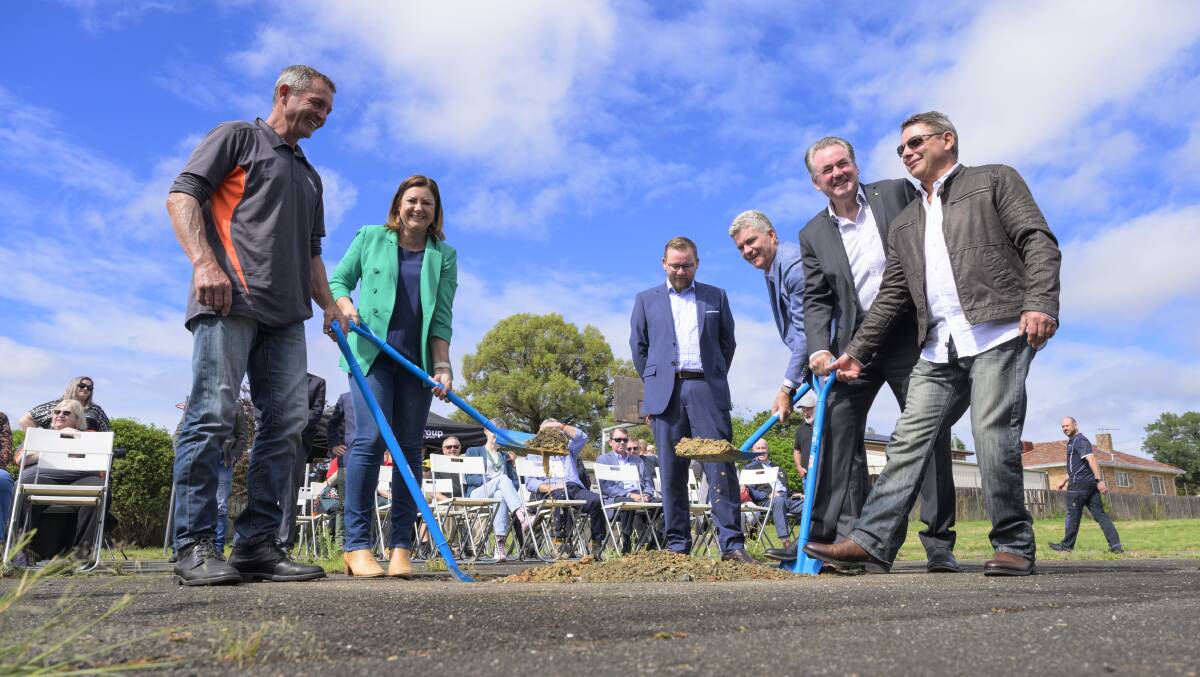 Helping to turn the first sod on Yvonne Cuschieri House on Friday were Yvonne's son Roger, Eden-Monaro MP Kristy McBain, Queanbeyan-Palerang mayor Kenrick Winchester, Monaro MP Steve Whan, Respite Care for Queanbeyan chair Paul Walshe and Yvonne's son Todd. Picture by Keegan Carroll
