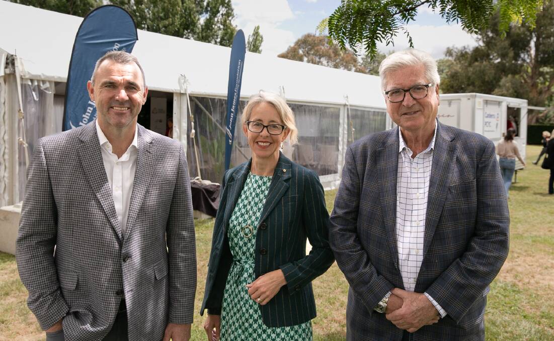 John James Foundation CEO Joe Roff, Snow Foundation CEO Georgina Byron and Hands Across Canberra CEO Peter Gordon together with the marquee in the Senate Gardens of Old Parliament House this week. Picture by Kris Kerehona