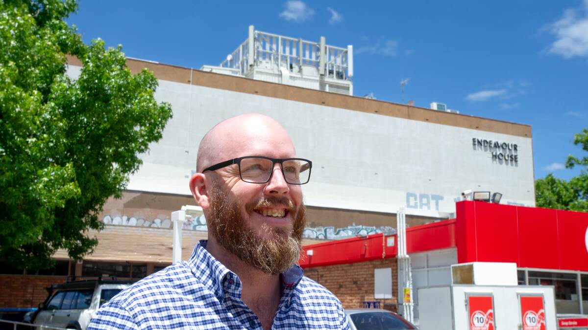 Endeavour House building manager Adam New at the announcement of the competition last December. The white wall will soon be adored by a publicly-voted mural. Picture: Elesa Kurtz