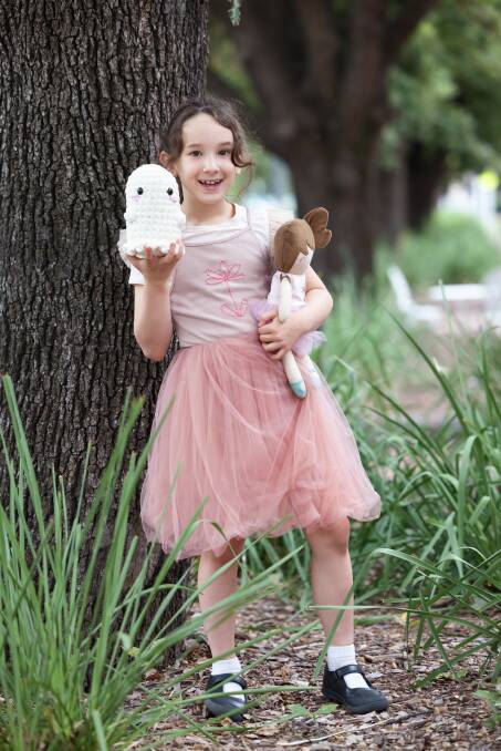 Ava Adore Hope with a crocheted Ghostie and doll from the book, created by Etsy markers. Picture: Sitthixay Ditthavong