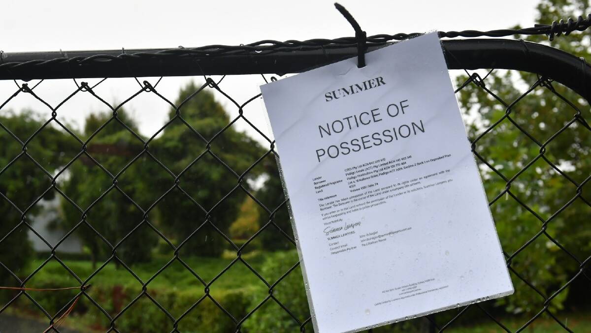The notice of possession attached to the gates of Pialligo Estate on Wednesday morning. Picture by Elesa Kurtz