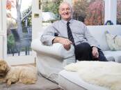 Professor Paul Smith at home in Red Hill on Friday with his dog George. Picture: Keegan Carroll