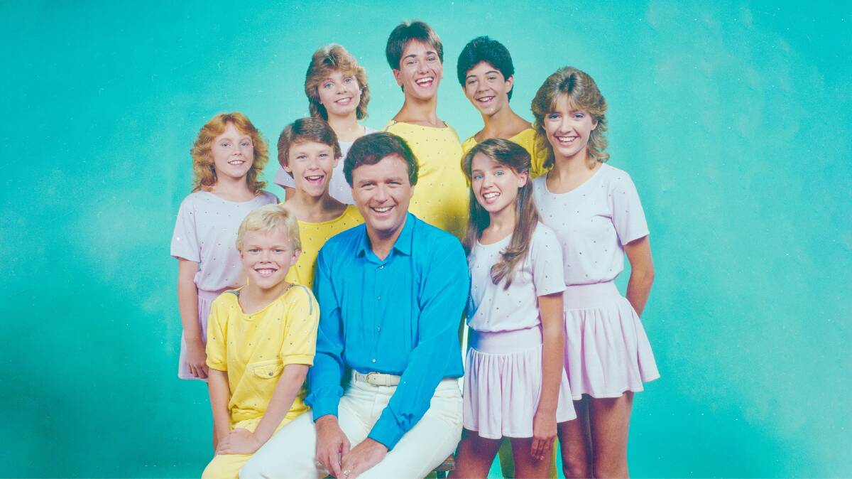 Young Talent Time host Johnny Young with the team in the pastel-hued 1980s. Picture: National Film and Sound Archive