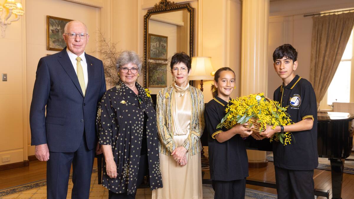 Governor-General David Hurley, Wattle Day Association president Dr Suzette Searle, Linda Hurley and Instrumental Music Program choir members Maya Tynan-Foster and Alborz Arabzadeh. Picture by Sitthixay Ditthavong