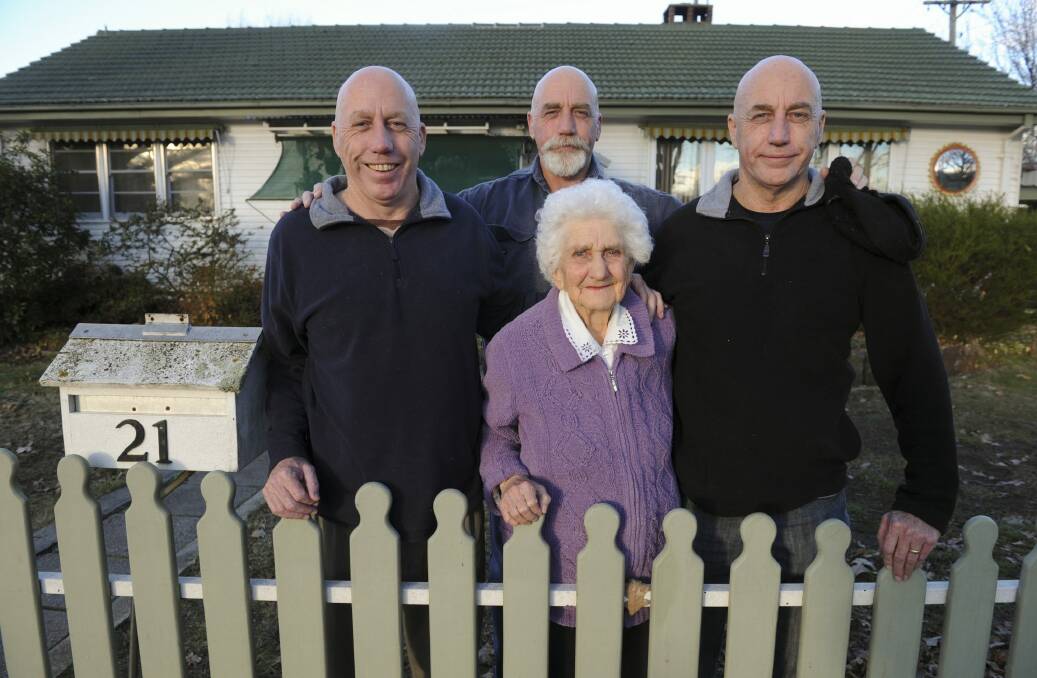 The French triplets - Tom, Mick and Bob - at the family home in Narrabundah with mum Elaine in 2016. Picture: Graham Tidy