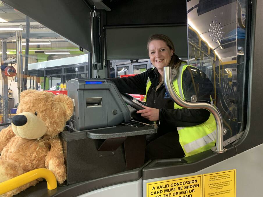 Canberra bus driver Suzie Martin on the bus with her contribution to the teddy bear hunt. Picture: Supplied