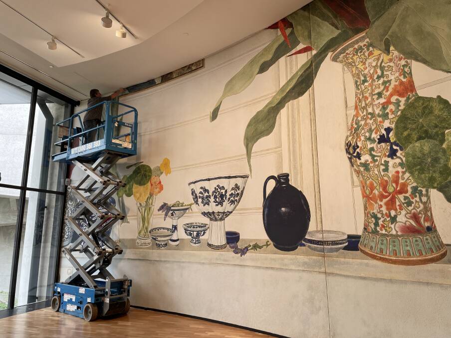 
The huge print of The kitchen shelf by Cressida Campbell going up on the wall at the National Gallery. Picture by Megan Doherty