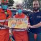 Sutton SES members with a copy of the book Emergency!, Emergency! - Vehicles to the Rescue by Rhian Williams. Picture: Rhian Williams