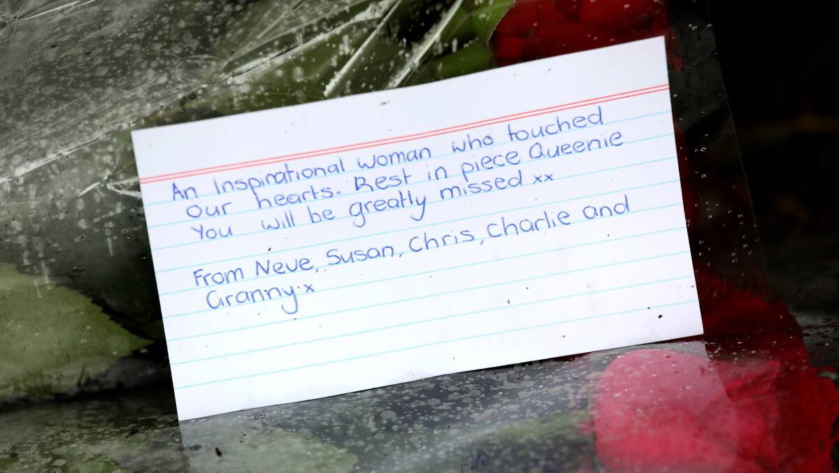 A heartfelt message to the Queen left with flowers at Government House on Friday. Picture by James Croucher
