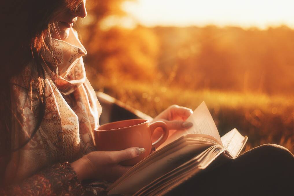 Cosy up with a good book this long weekend. Picture: Shutterstock