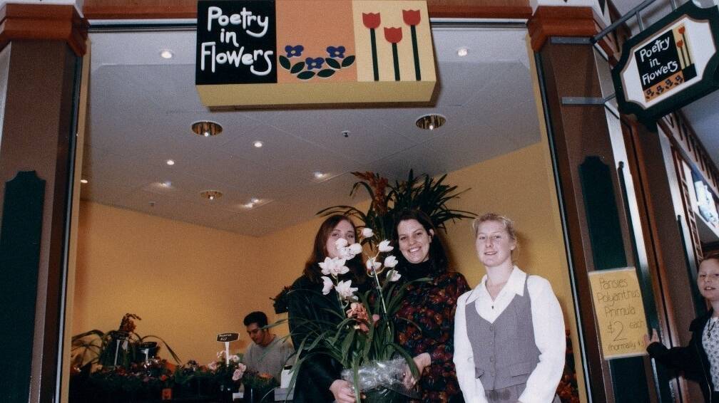Poetry in Flowers owner Liz Toussaint (centre) with her brother David in the background, niece Skye and co-worker Robin on opening day 25 years ago. Picture supplied