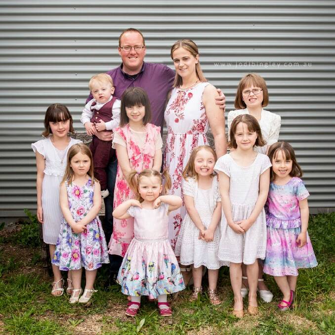 Mark and Claire Hooker and their nine children.