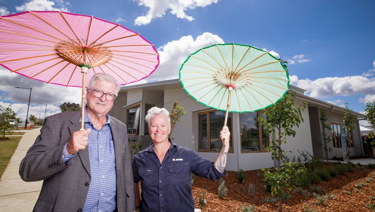 Hands Across Canberra CEO Peter Gordon and Kane Constructions ACT general manager Jo Farrell at the sunny launch of the Strathnairn Charity House on Thursday. Sitthixay Ditthavong 