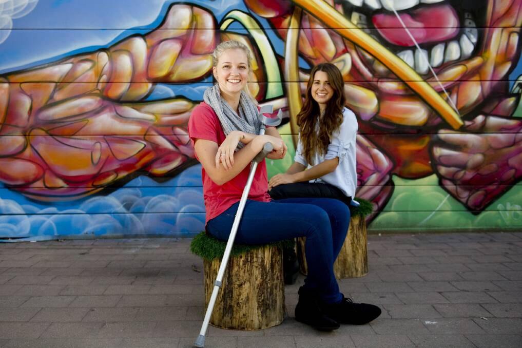 Emma Carey and Jemma Mrdak in Canberra in 2014, a year after Jemma's accident. Picture by Jay Cronan