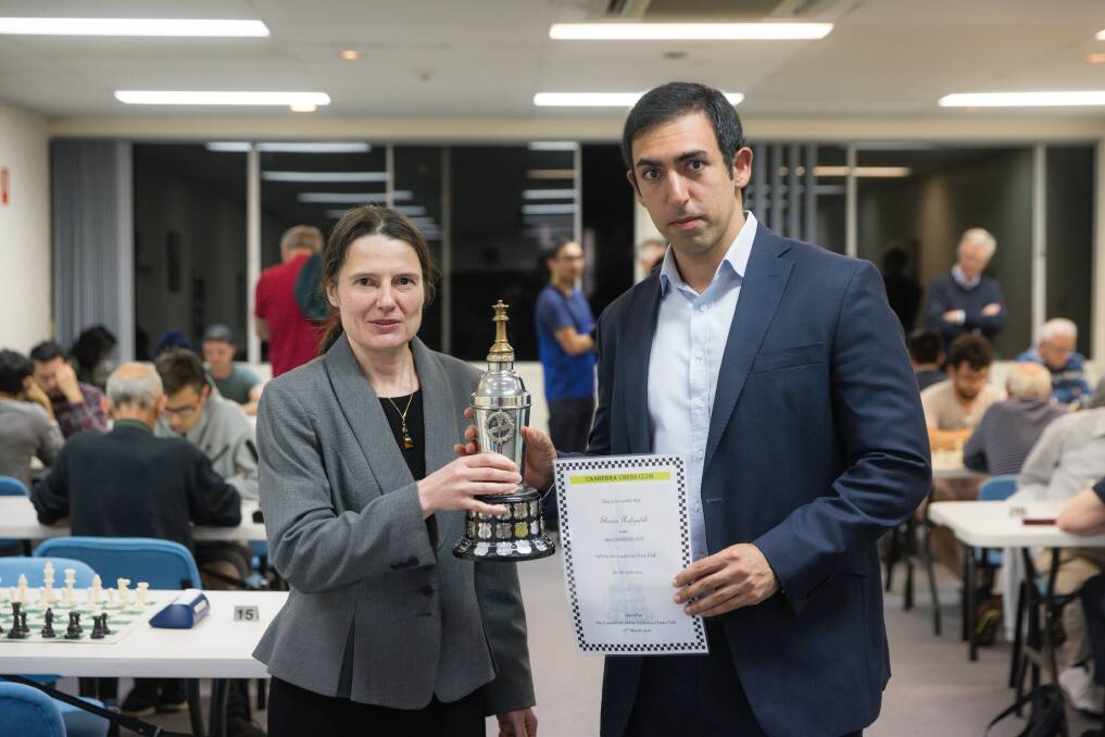 Canberra Chess Club director Nathalie Tisserand with Shervin Rafizadeh with the Canberra Cup. Picture: Sitthixay Ditthavong