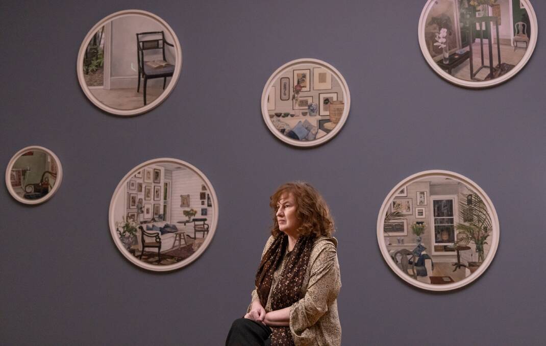 Cressida Campbell sitting amongst her works in the National Gallery of Australia. Picture by Greg Nagel