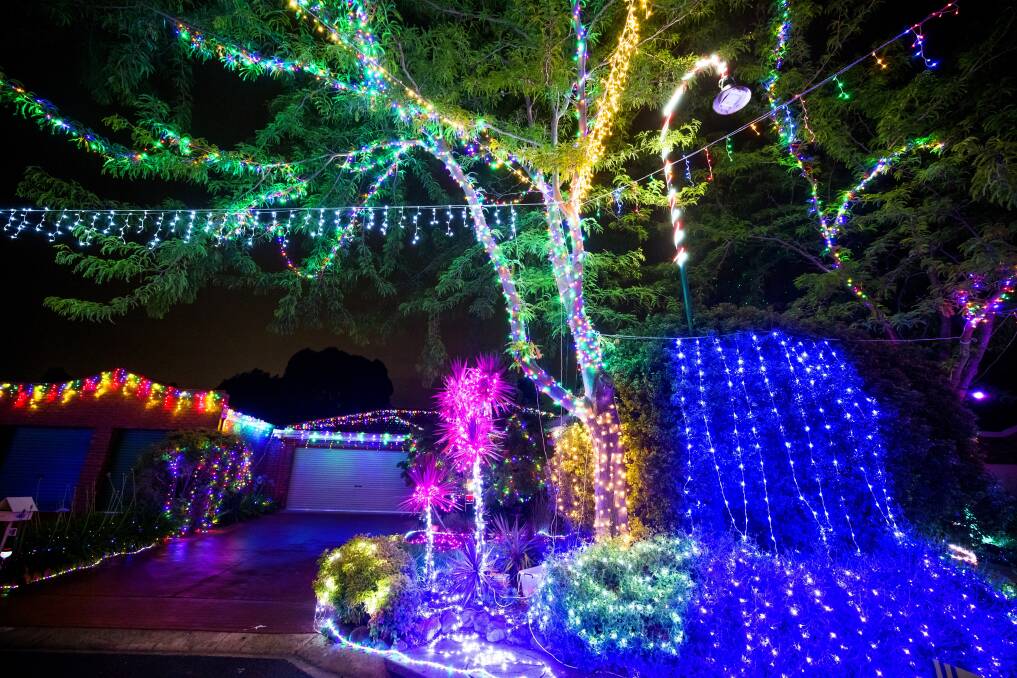 Neighbours in Burraly Court start in at Halloween discussing what Christmas lights to put up. Picture: Sitthixay Ditthavong