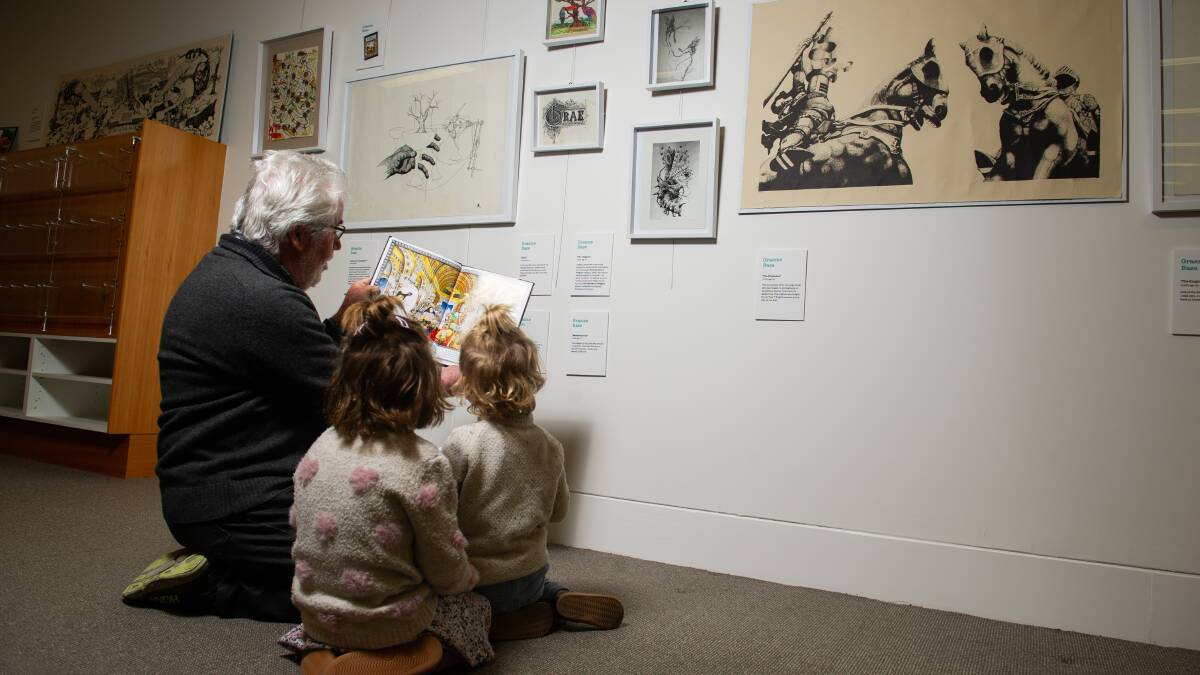 Simon Clarke, with his grandchildren, at the Juvenilia exhibition at the Civic Library. Picture by Elesa Kurtz