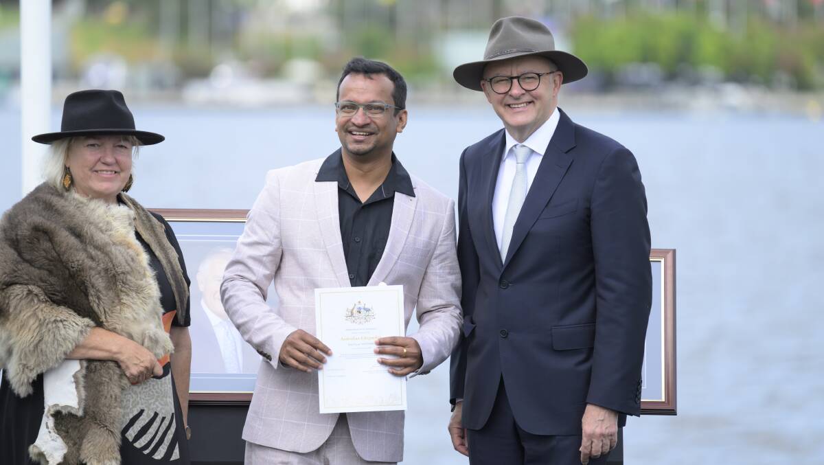 Joby Cyriac with Prime Minister Anthony Albanese and Ngunnawal Elder Caroline Hughes. Picture by 