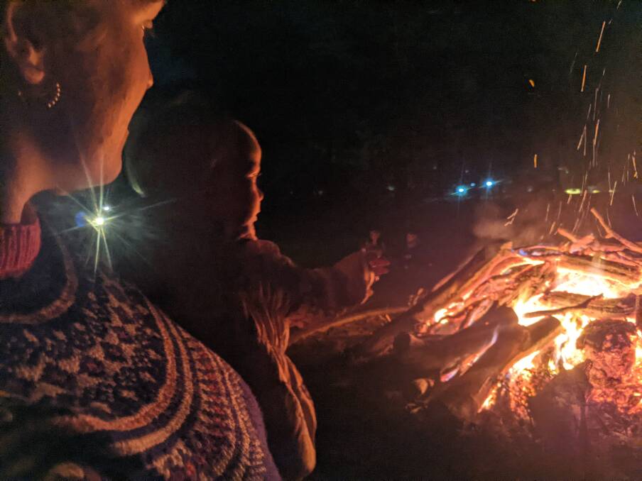 Anna Taylor, with daughter Laila, 18, months at the Embassy of Sweden bonfire on Friday night. Picture: Megan Doherty