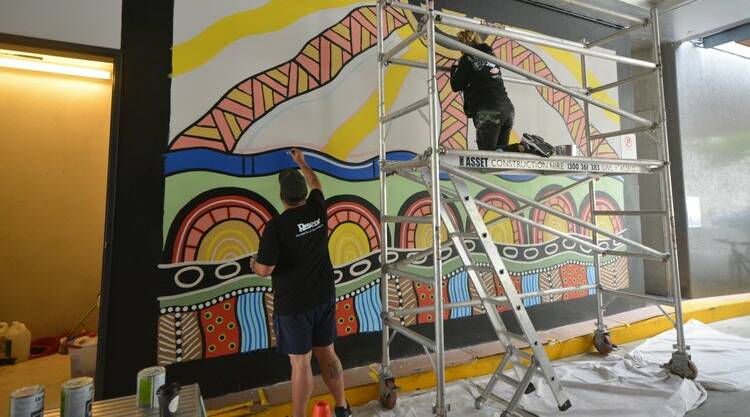 Bronwen Smith and Gavin Chatfield working on their mural at Mode3 - 24 Lonsdale Street, Braddon. Picture: ACT Government