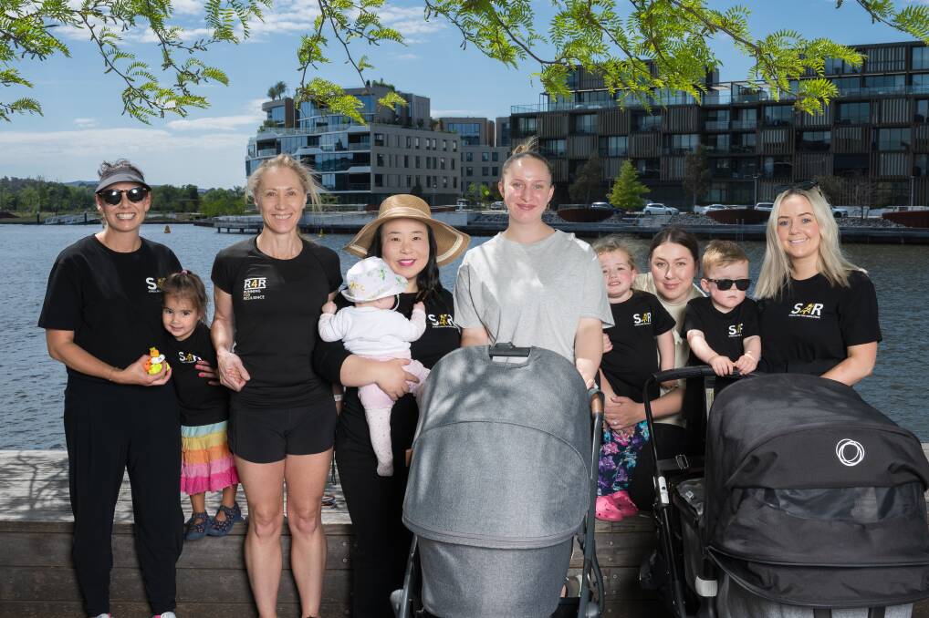 Strolling for Resilience participants (l-r) Jane Collins and Ireland Camara, two, Melissa Oloyede, Elizabeth Lee and Ava, six months, Chloe Stanojevic, Tania Brozinic and Kristina, three, and Olivia Alexander and Harvey, three. Picture by Sitthixay Ditthavong