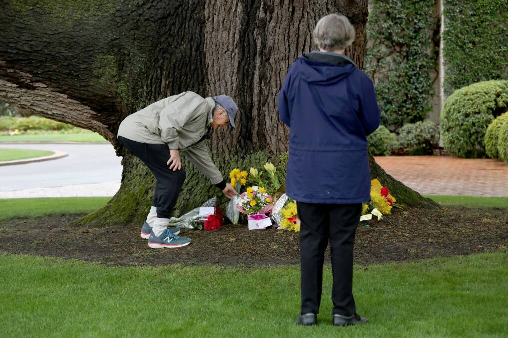 Richard and Maureen Scutter of Macquarie lay flowers at Government House. Picture by James Croucher
