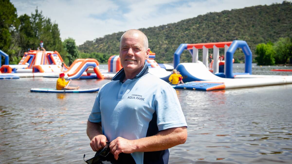 Ben Hawke at the Canberra Aqua Park on Wednesday. The inflatable obstacle course on Lake Burley Griffin is now open until the end of March. Picture by Elesa Kurtz