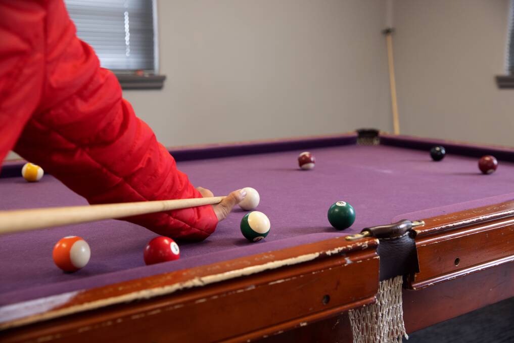 A teenager playing pool at the new PCYC HQ at Fairbairn. Picture: Sitthixay Ditthavong