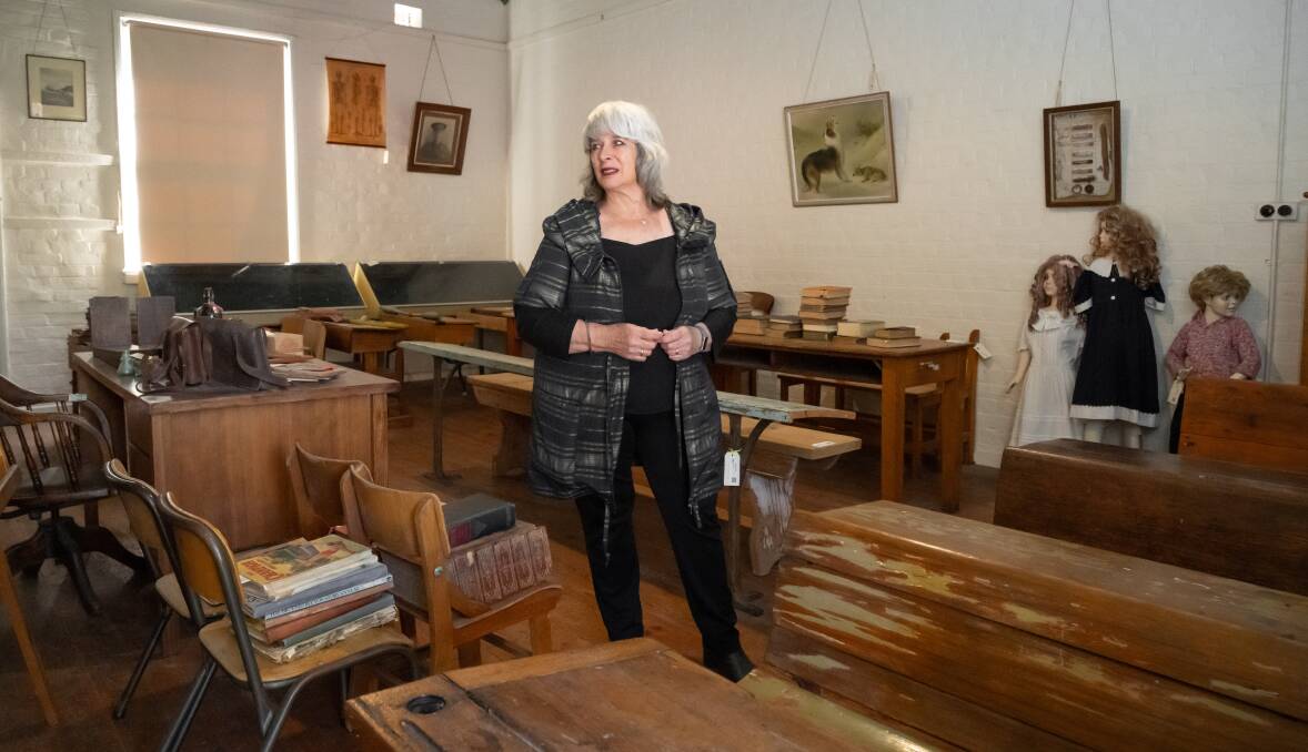 Old desks and books Elizabeth collected to furnish the original classroom is also for sale. Picture by Elesa Kurtz