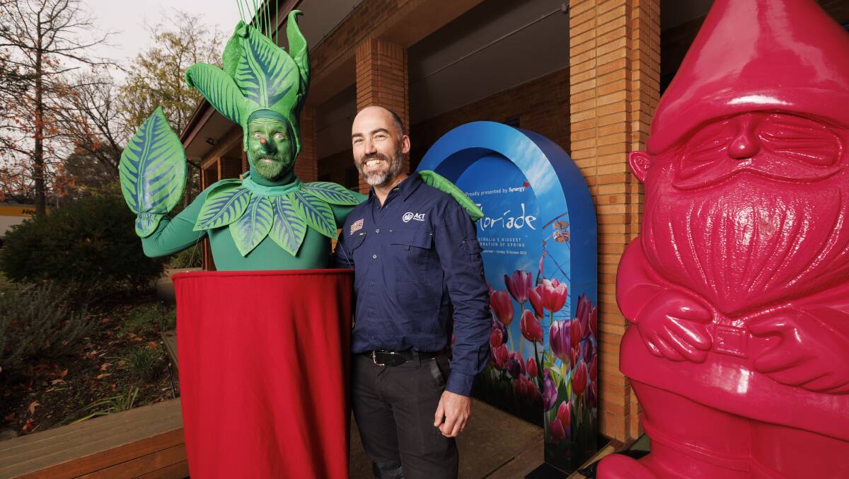 Floriade head gardener Tim Howard at the festival launch on Friday with a plant man and Floyd the giant pink Floriade gnome. Picture by Keegan Carroll