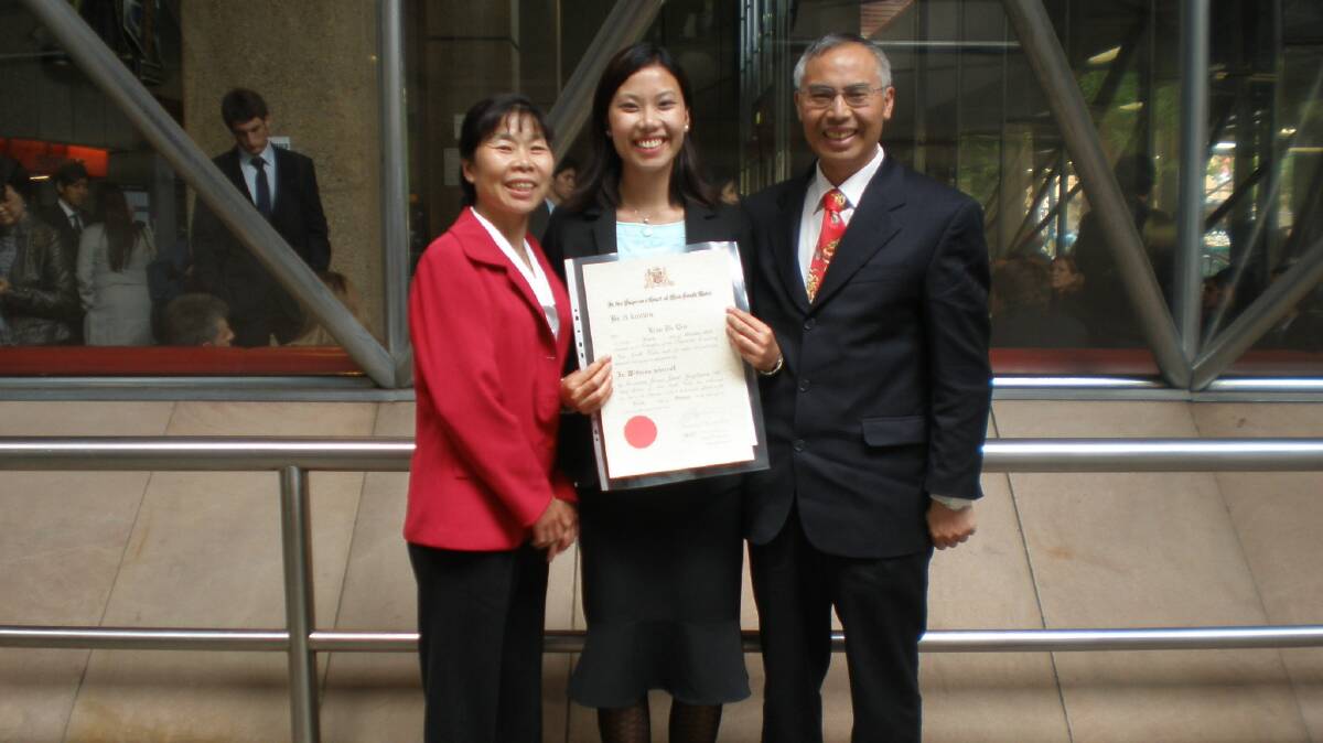 Admission as a solicitor with her parents Ping Hua He and Ting Kui Qin. Picture supplied 
