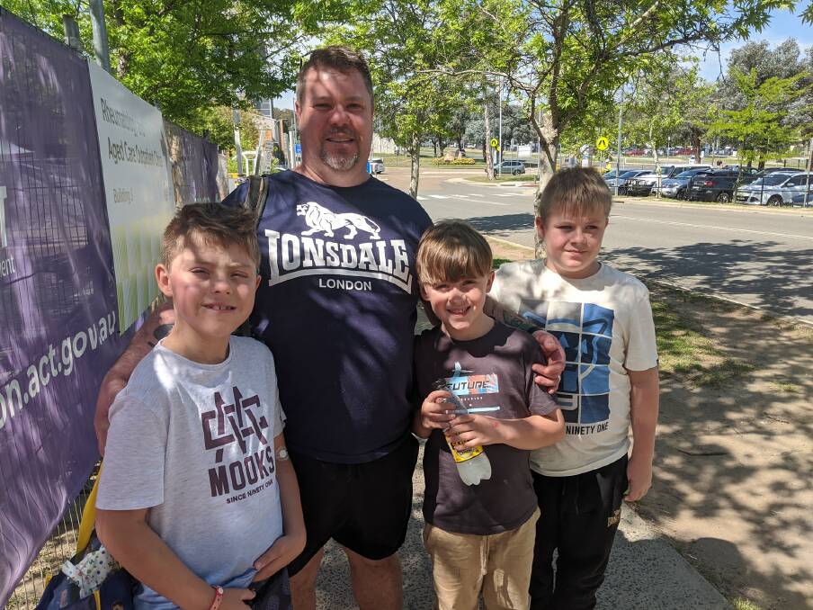 Justin Munce of Goulburn with sons Aiden (10), Dylan (8) and Cody (10) after meeting Leo Sayer. Picture: Megan Doherty