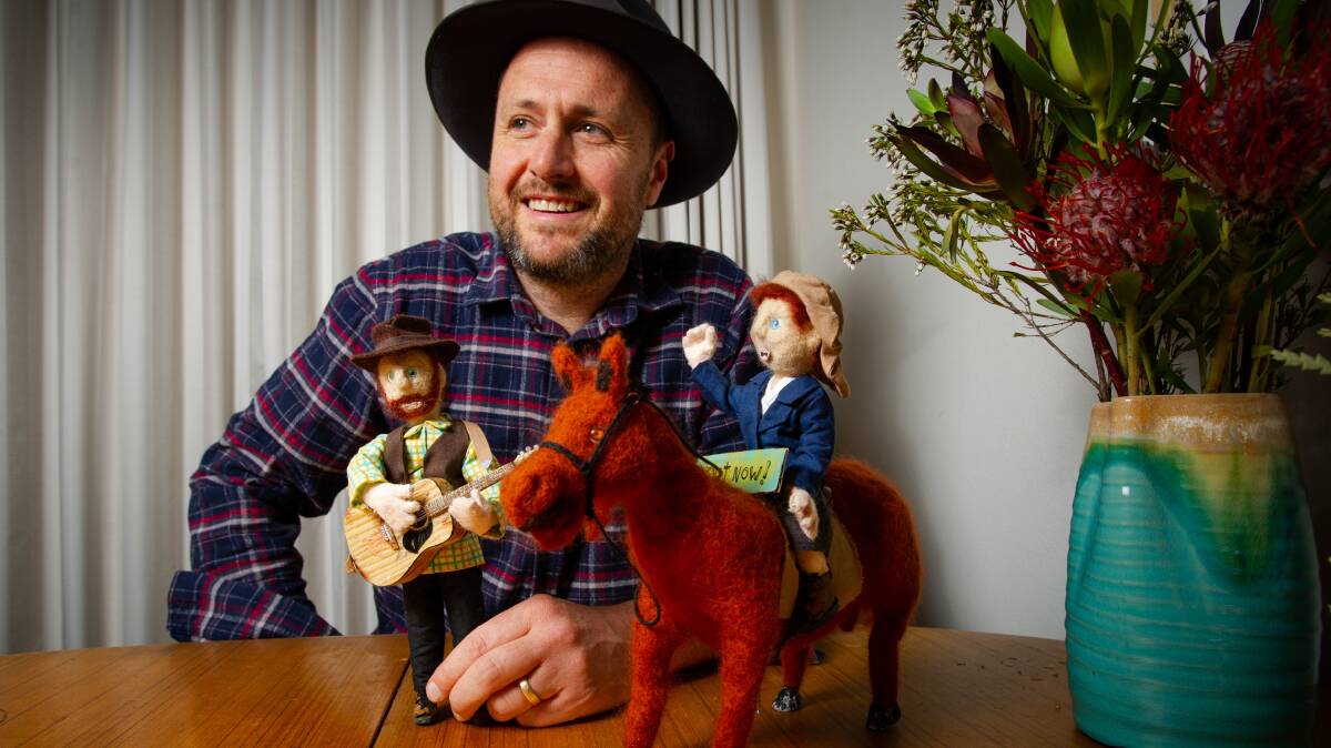 Musician CJ Shaw at home in Canberra with models of himself and Lennie Gwyther used in the video. Picture: Elesa Kurtz
