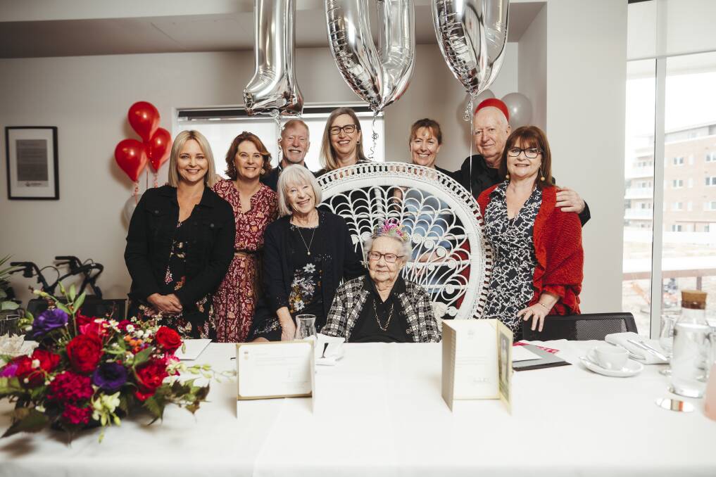 Elizabeth Lovie at her 100th birthday high tea at Goodwin Village Farrer on Thursday with (from left), grand-daughters Emma Nicholson and Kelly Charls, son Geoffrey Lovie and daughter Sue Charls, grand-daughters Tracy Gillard and Peta Power, son David Lovie and grand-daughter Megan Wallace. Picture: Dion Georgopoulos