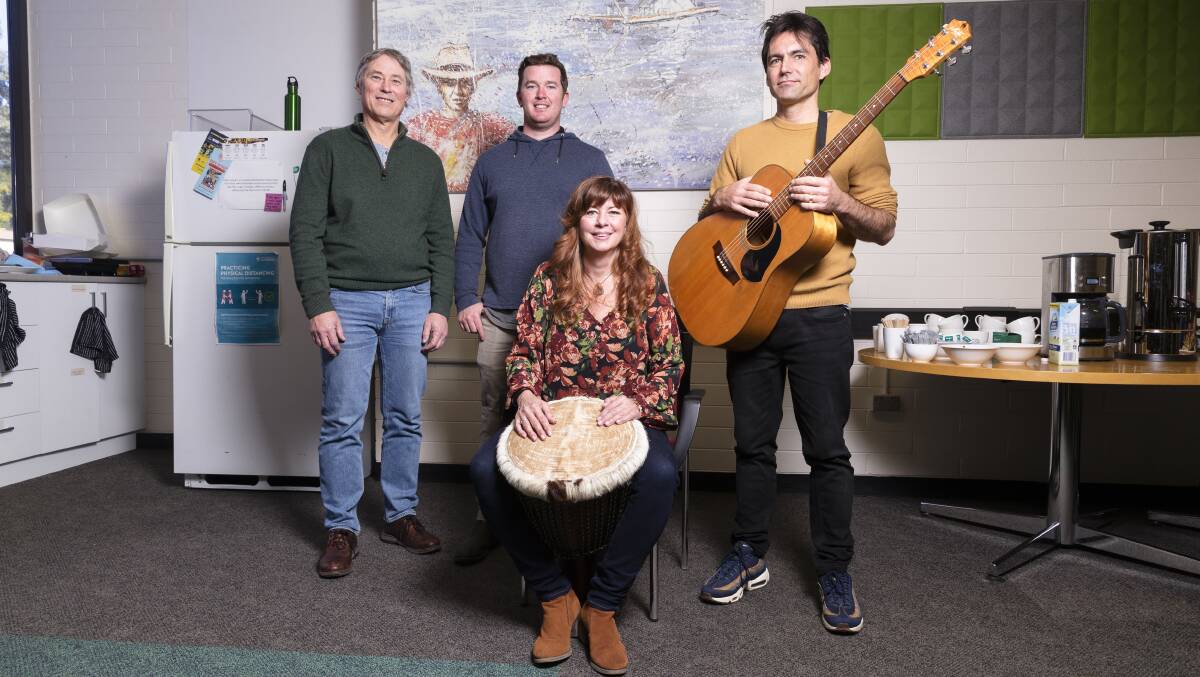 Canberra's tepee man William Woodbridge (middle) at the University of Canberra on Friday where biologists and band members Stephen Sarre, Llara Weaver and Will Higgisson unveiled their song about him, Float Me a Tepee. Picture: Keegan Carroll