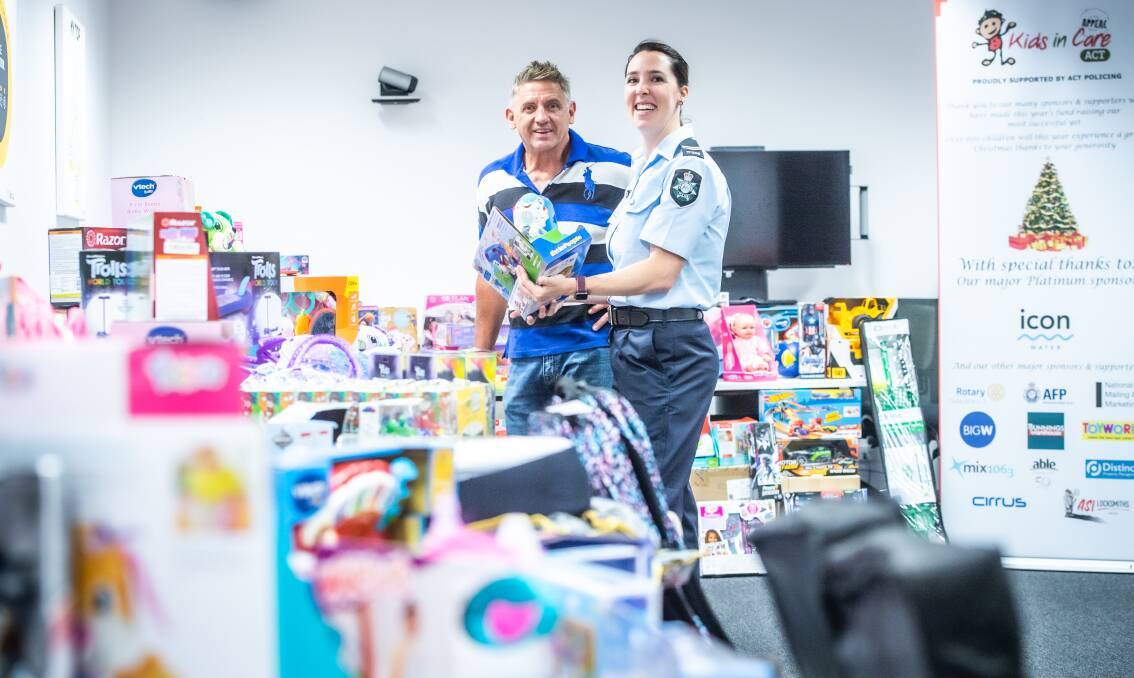 Detective Sergeant John Giles and Detective Senior Constable Alex Uren with the donated toys. Picture: Karleen Minney