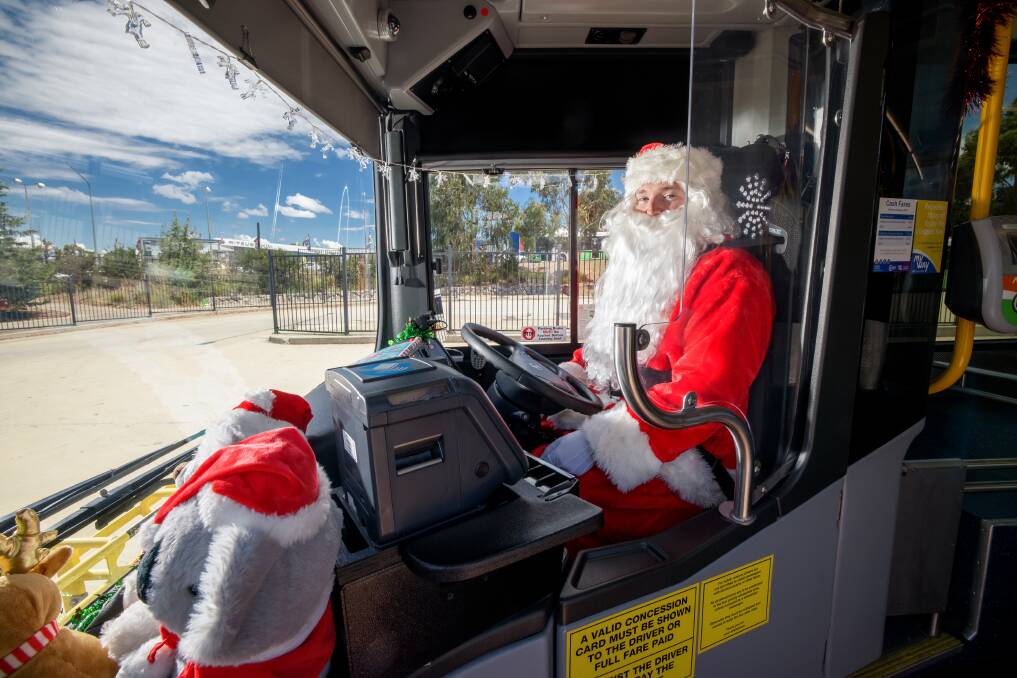 Passengers get a kick out of seeing Santa driving their local bus. Picture: Sitthixay Ditthavong 