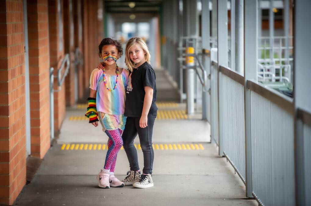 Queanbeyan South year one students and best friends Ka'ili Giteau-Tai and Charlotte Vanunen after Charlotte had her hair cut off to make a wig for cancer patients. Picture: Karleen Minney
