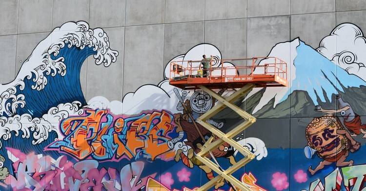 The mural by DAI + Rub3n1sm + Seth One + Wiskey + PHIBS underway. Yamaroshi - 32 Mort Street, Braddon. Picture: ACT Government