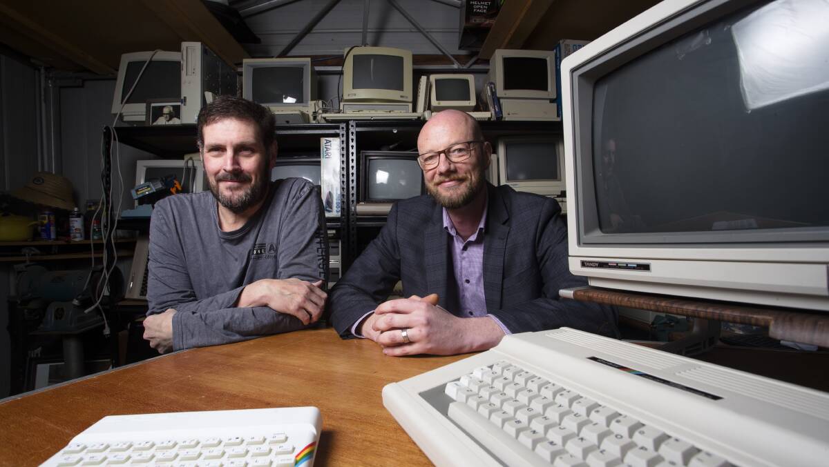 Randall Crook and Jason Weber, in Jason's home shed in Tuggeranong, are this weekend staging the first Canberra Retro Computer Fair. Picture: Keegan Carroll