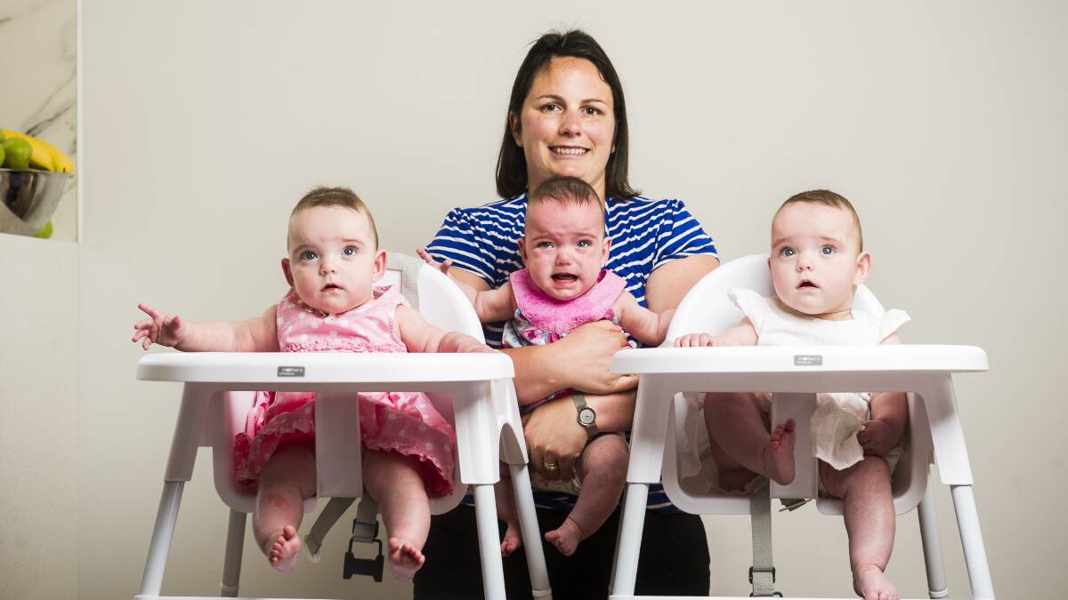 In their high chairs at seven months. Picture by Dion Georgopoulos