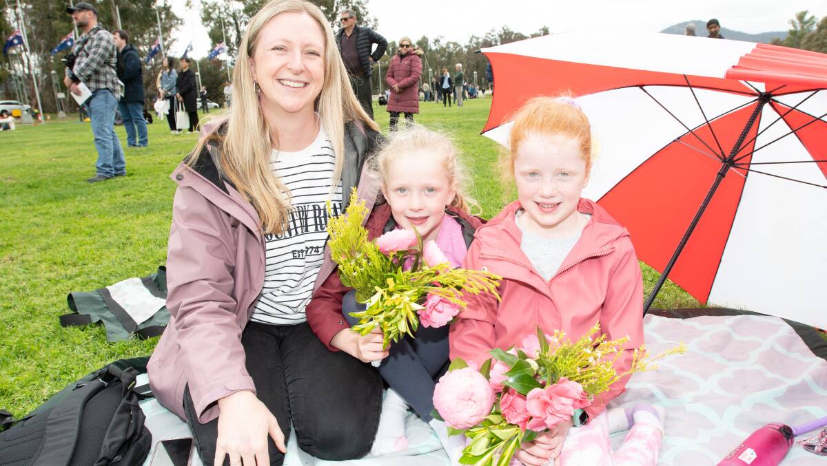 Nicole Lyas with twin daughters Amelia and Chloe, 7, from Stirling, at Parliament House on Thursday. Picture by Elesa Kurtz