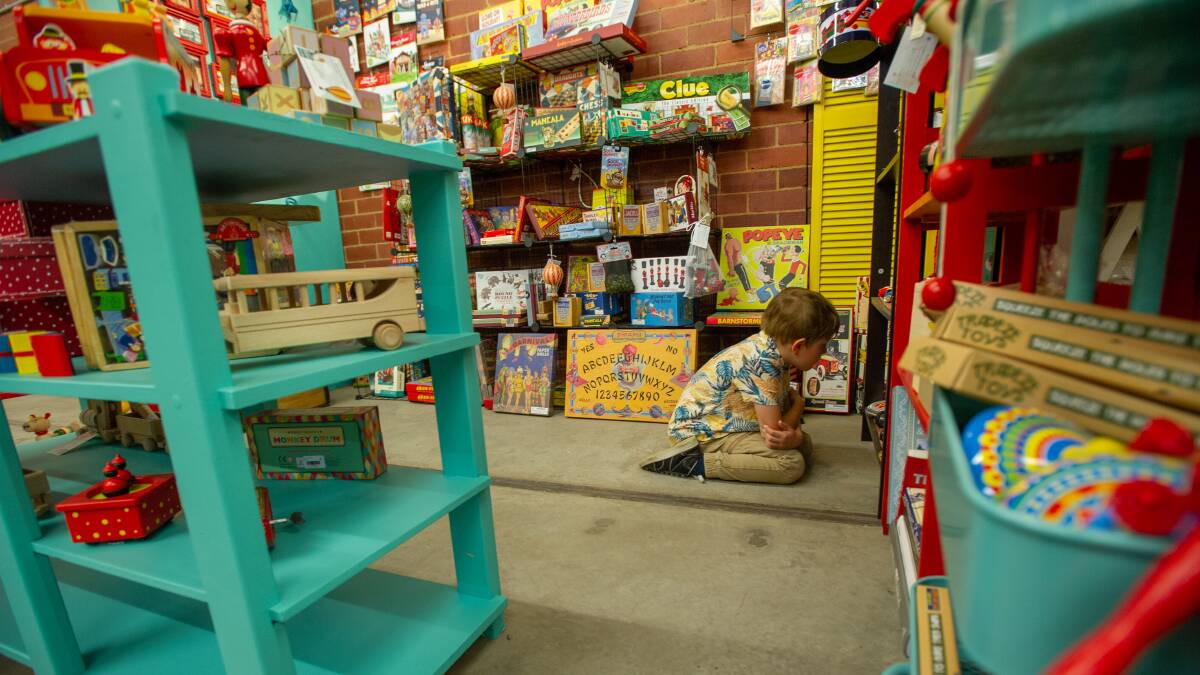 Seth Hickey, eight, gets a good look at the vintage toys at Dirty Jane's. Picture: Karleen Minney