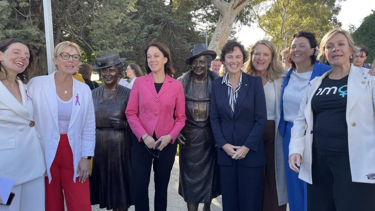 Female politicians including teal independents were among the first to grab a photo with the new sculpture. Picture by Megan Doherty
