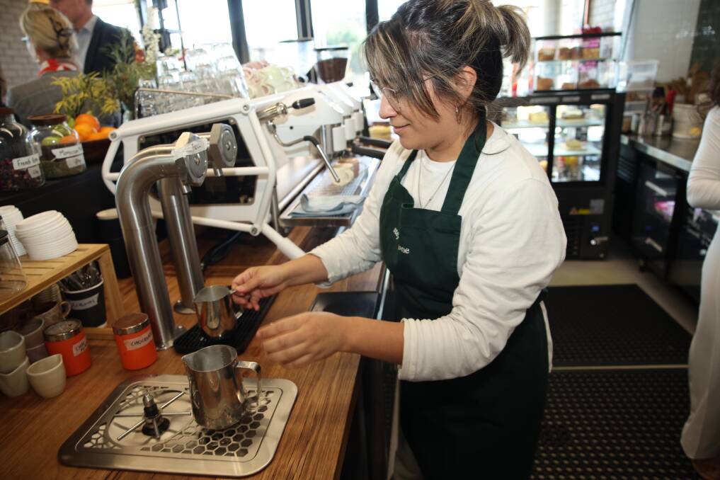 Celeste Juarez making coffee at the launch.