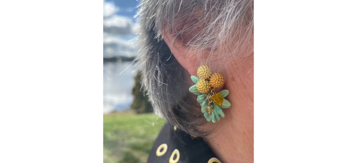 Wattle Day Association president Dr Suzette Searle's wattle earrings. Picture by Megan Doherty