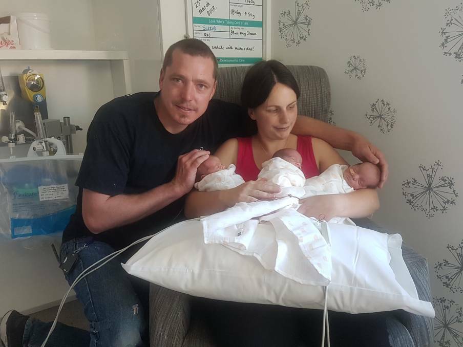 Emma and Matt Keen with the triplets in the Canberra Hospital not long after they were born in 2018. Picture: Supplied
