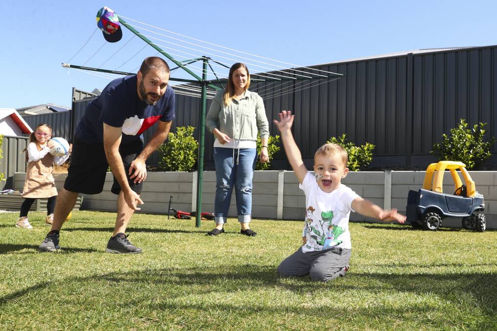 Connor Gregg, three, with his mum Whitney and dad David and sister Lola, five, at home in Googong. Picture: Keegan Carroll