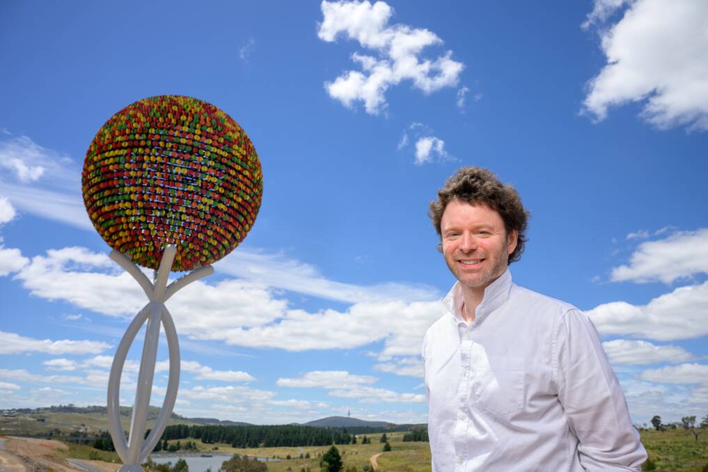 Canberra artist Benjamin Shine with his new work Everchange in Denman Prospect. Picture by Sitthixay Ditthavong